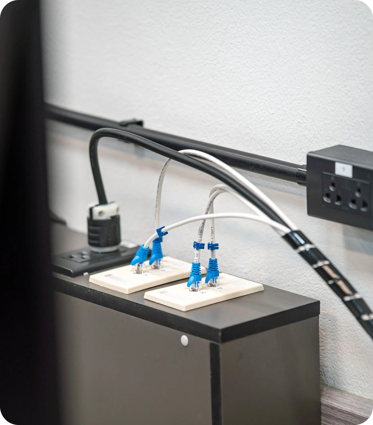 Network cables connected to wall outlets.